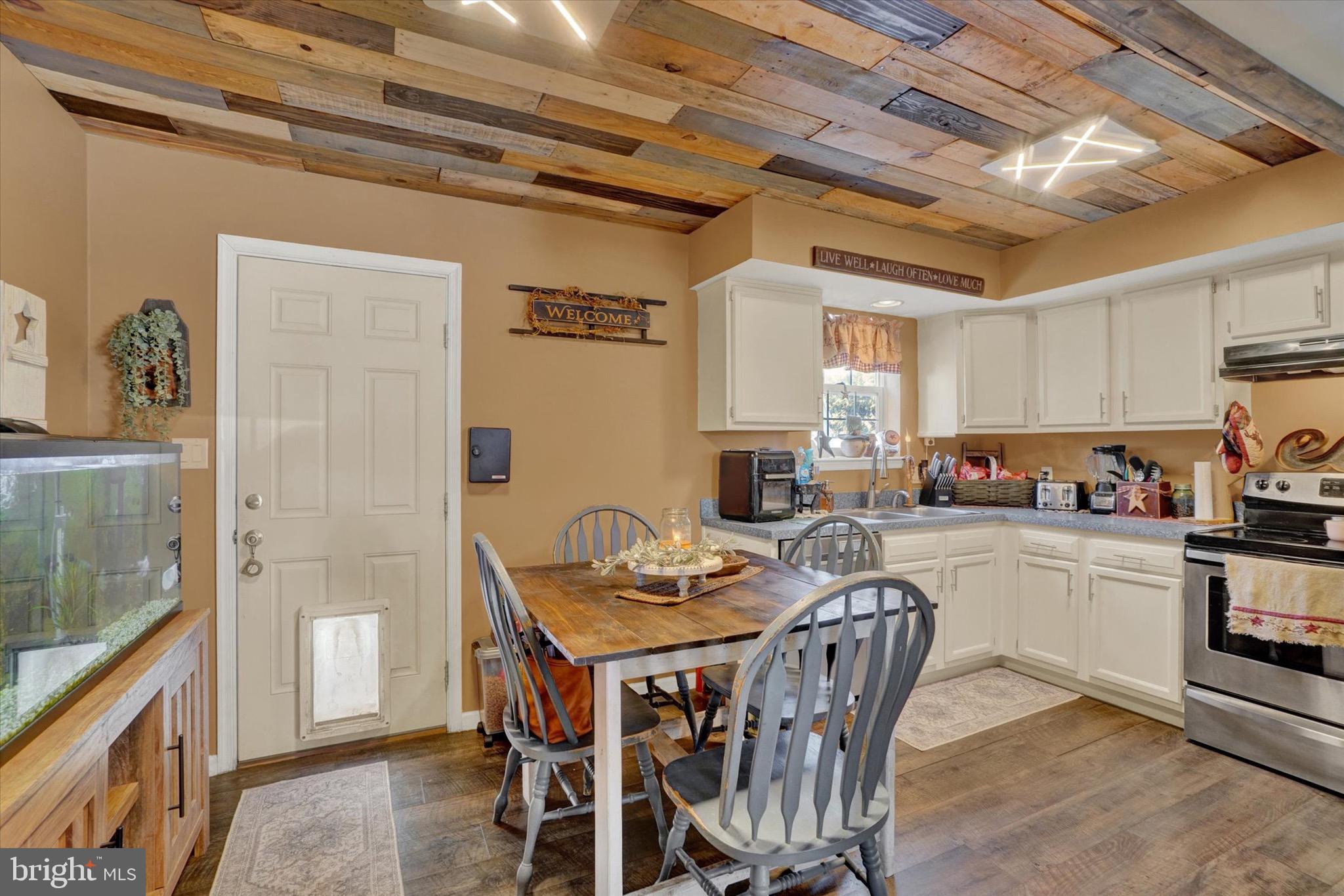 3030 Solar Drive Dover, PA 17315 - Photo 8 of 22 a kitchen with a table chairs refrigerator and cabinets