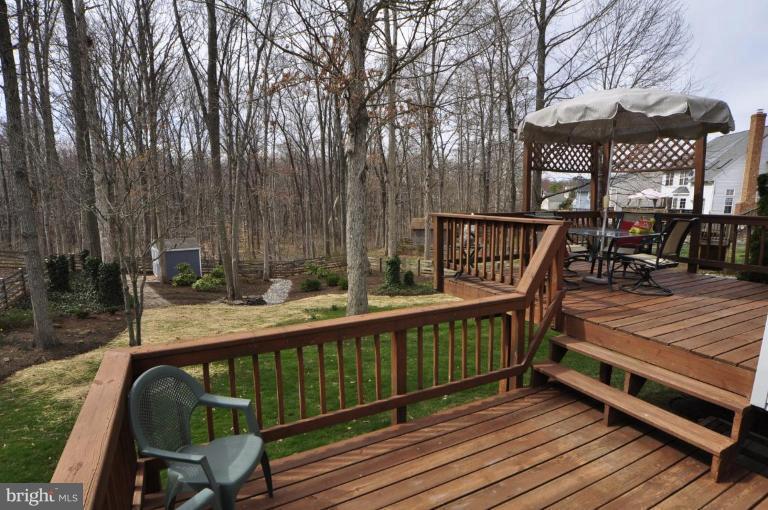 812 Potomac Ridge Court Sterling, VA 20164 - Photo 11 of 30 a view of a roof deck with wooden fence and floor