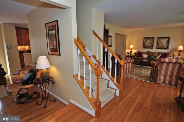 812 Potomac Ridge Court Sterling, VA 20164 - Photo 3 of 30 a dining room with wooden floor and stairs