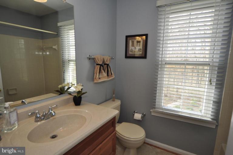 812 Potomac Ridge Court Sterling, VA 20164 - Photo 21 of 30 a bathroom with a sink toilet and a mirror