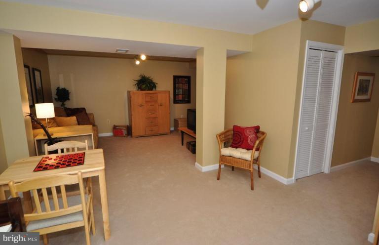 812 Potomac Ridge Court Sterling, VA 20164 - Photo 24 of 30 a living room with furniture and a wooden floor