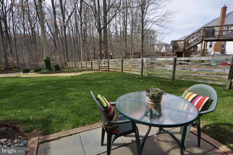 812 Potomac Ridge Court Sterling, VA 20164 - Photo 27 of 30 a view of a house with backyard and sitting area