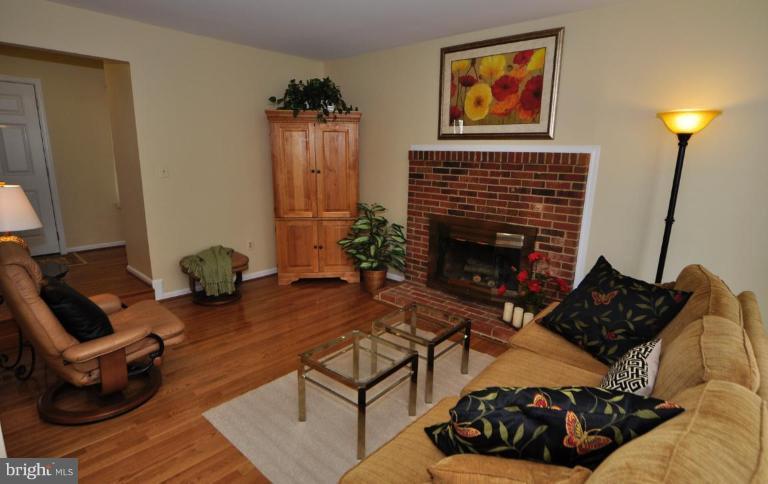 812 Potomac Ridge Court Sterling, VA 20164 - Photo 5 of 30 a living room with furniture and a fireplace