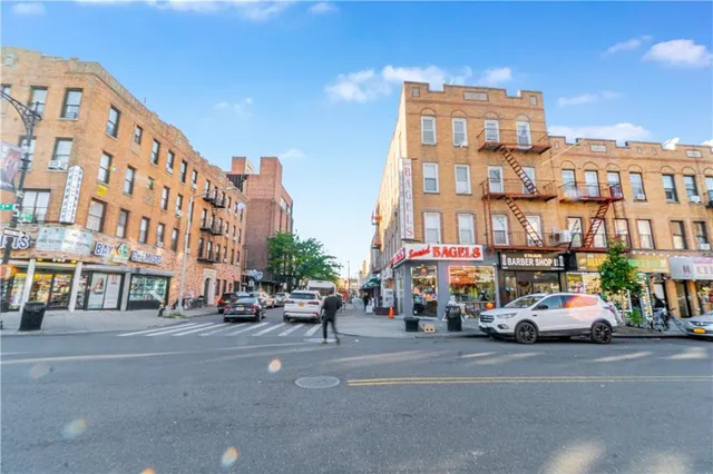a city street lined with buildings and cars