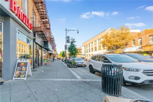a view of a patio with dining table and chairs