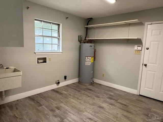 a view of a house with a yard and garage