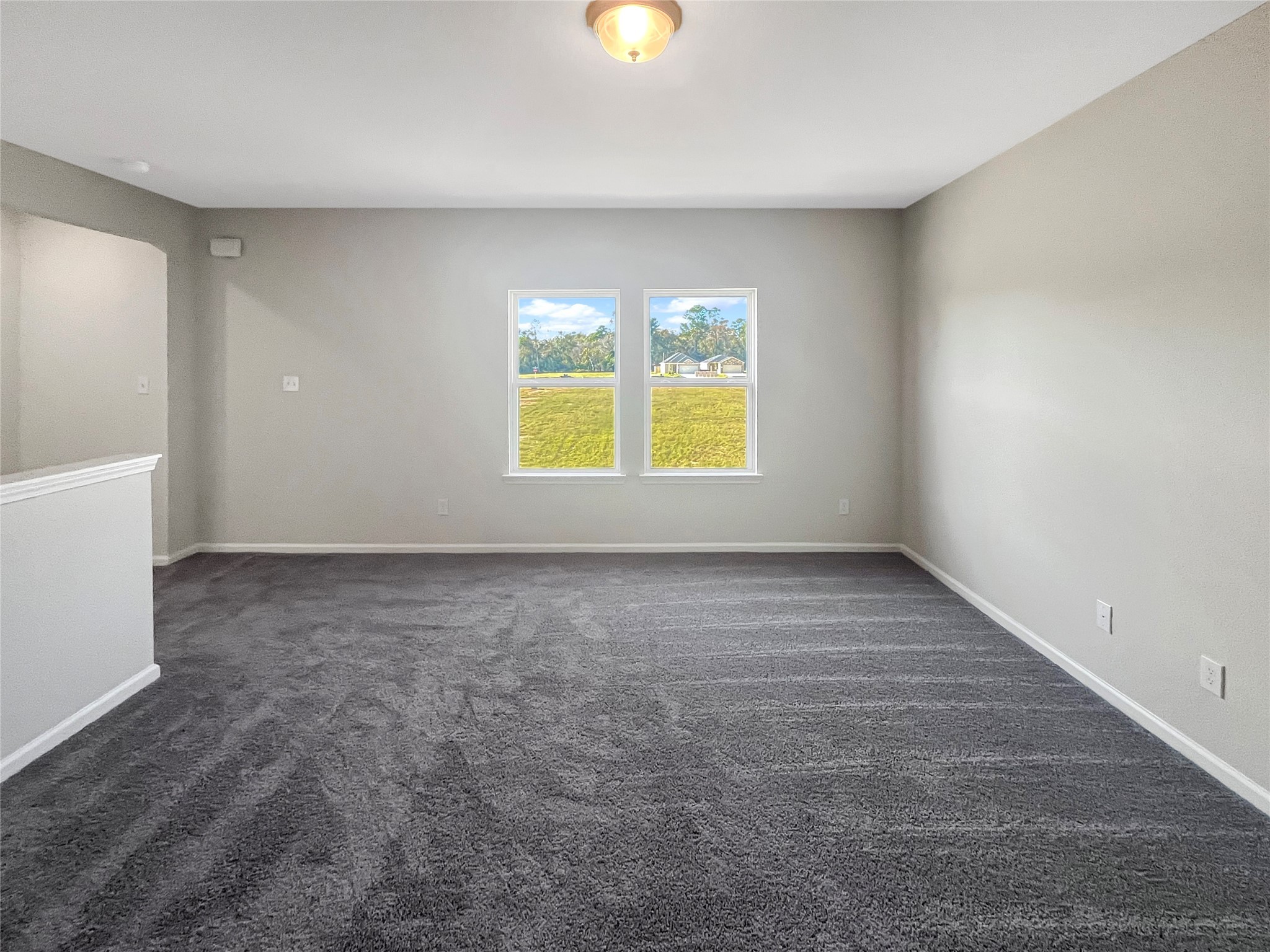 9758 Enclave Ridge Road Willis, TX 77318 - Photo 14 of 25 an empty room with a window and a mirror