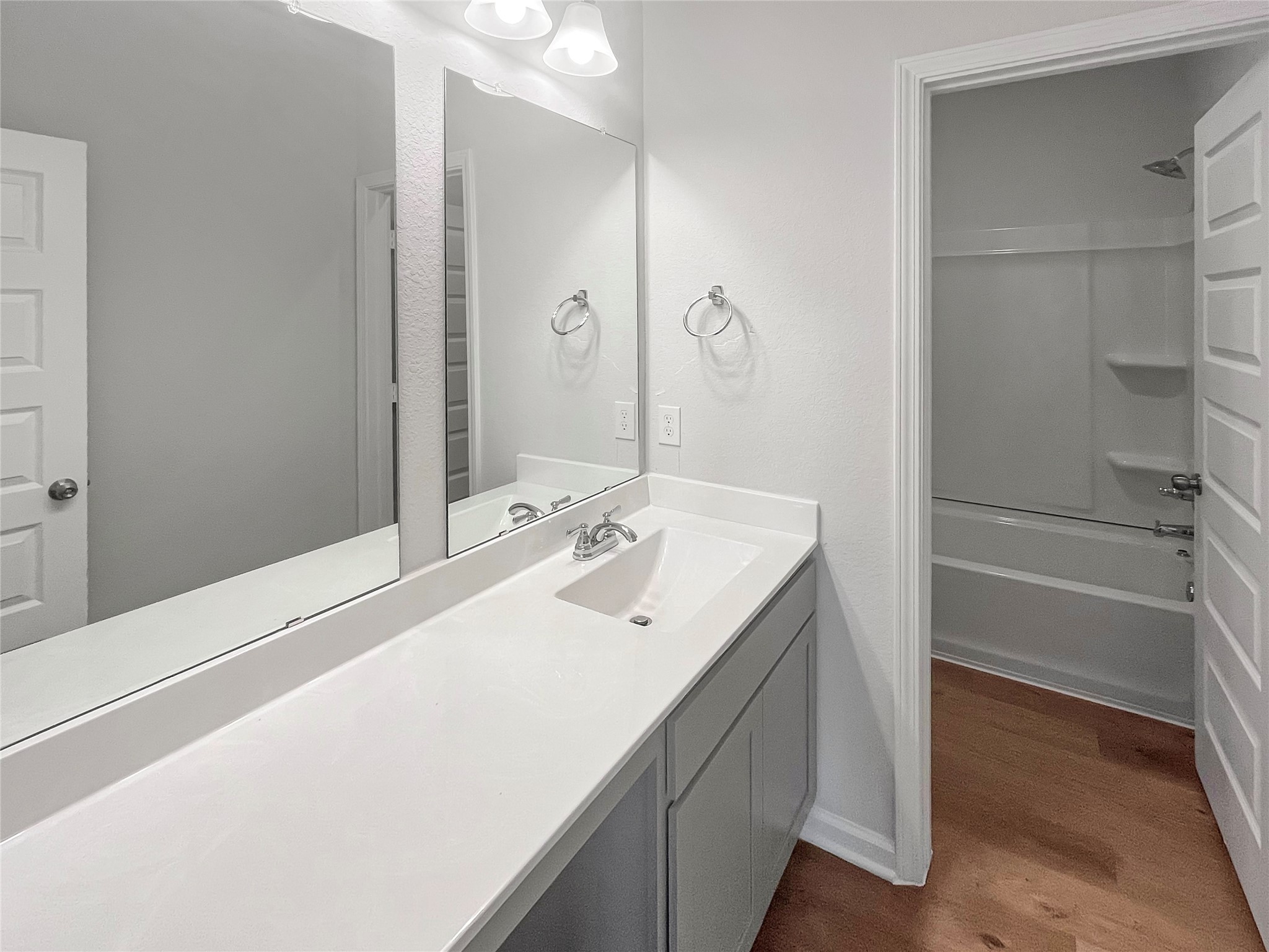 9758 Enclave Ridge Road Willis, TX 77318 - Photo 20 of 25 a bathroom with a sink and a mirror