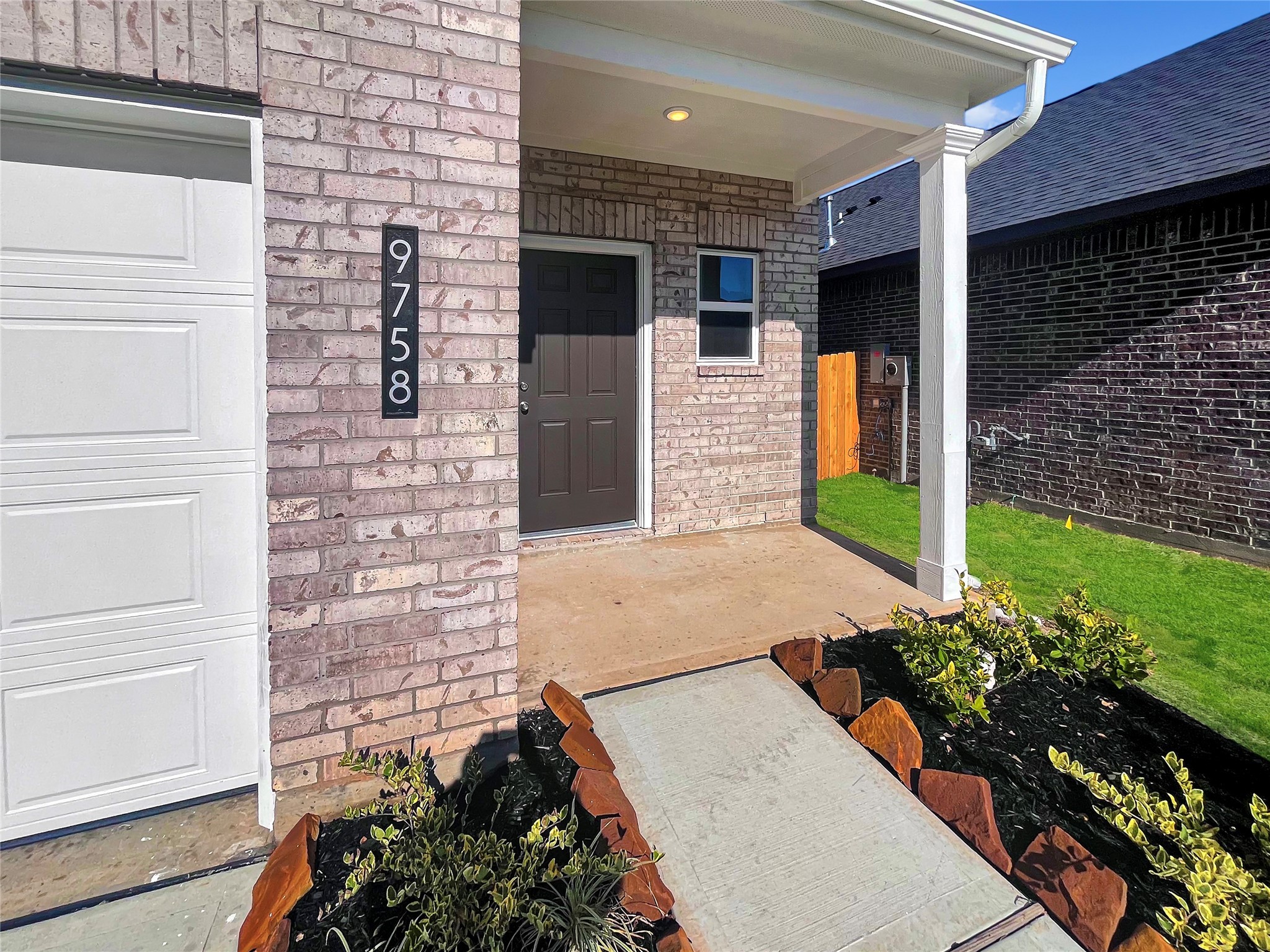 9758 Enclave Ridge Road Willis, TX 77318 - Photo 2 of 25 a view of an entryway with a flower pot