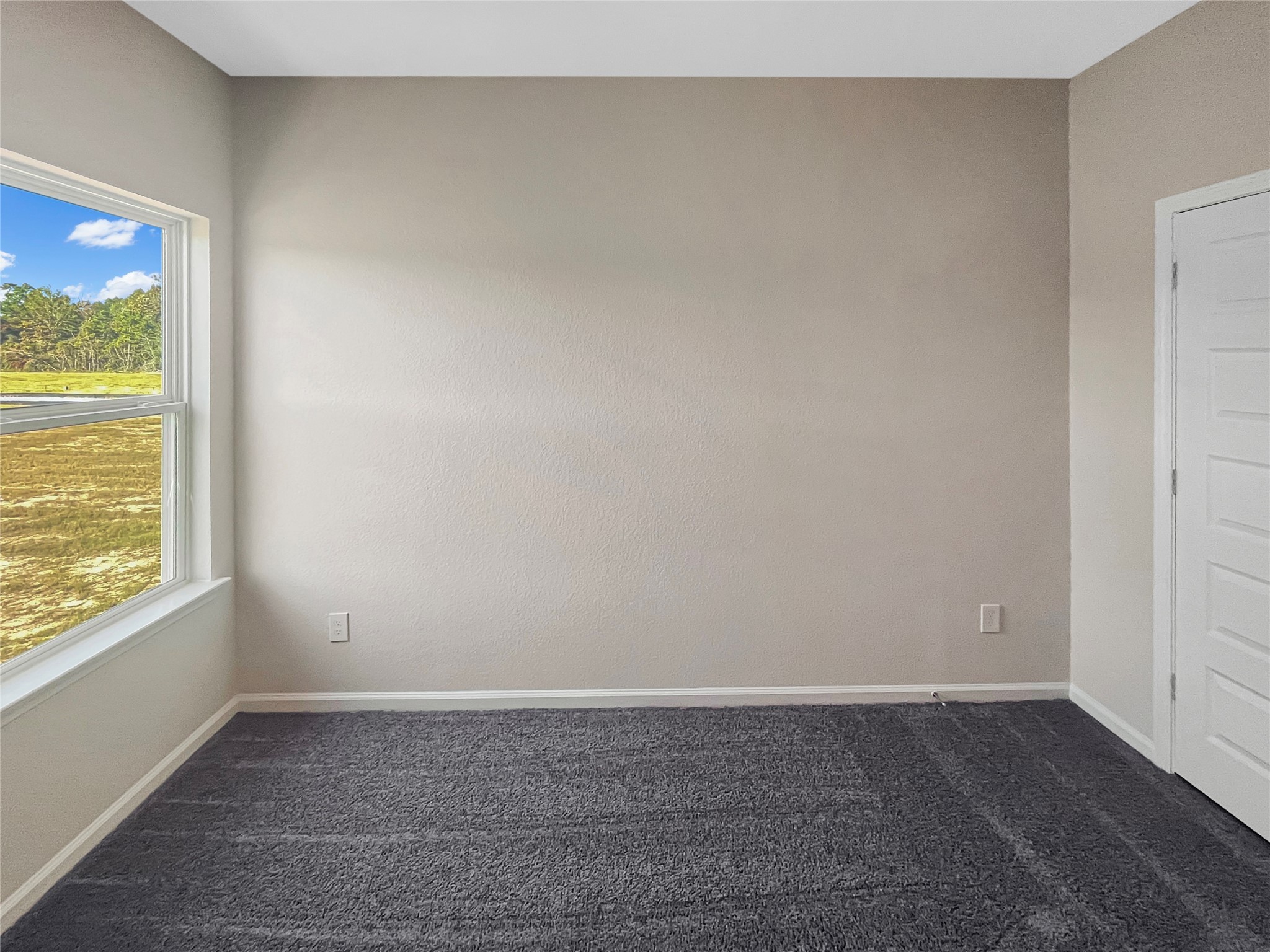 9758 Enclave Ridge Road Willis, TX 77318 - Photo 21 of 25 a view of an empty room and window