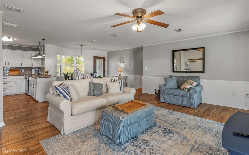 1615 Airport Loop Homer, LA 71040 - Photo 12 of 35 a living room with furniture a ceiling fan and a rug