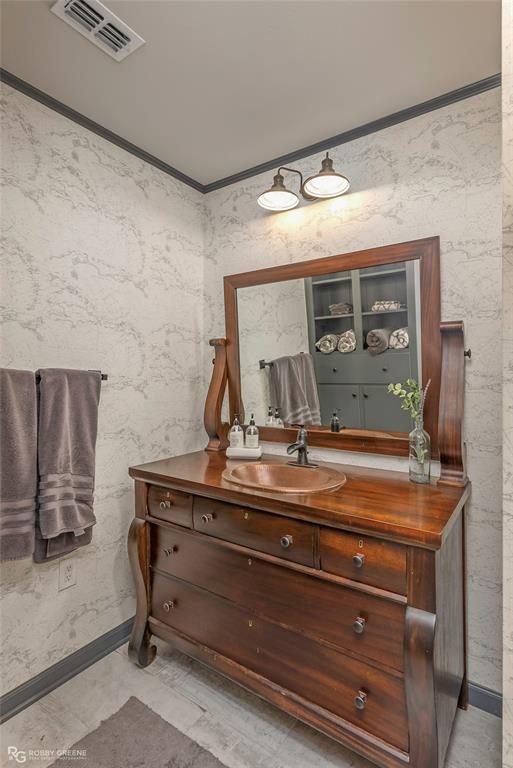 1615 Airport Loop Homer, LA 71040 - Photo 22 of 35 a bathroom with a sink and a mirror
