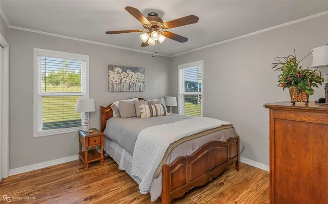 a bedroom with a bed and a potted plant