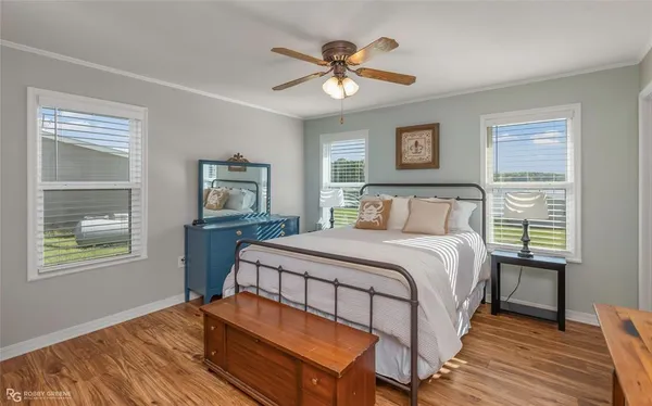 a bedroom with a bed and a table with chair