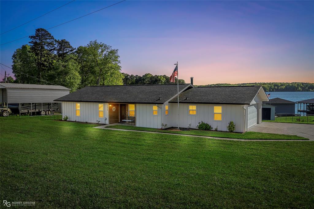 1615 Airport Loop Homer, LA 71040 - Photo 30 of 35 a front view of a house with a yard