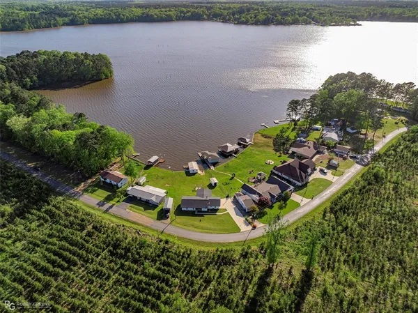 a view of a lake with a yard