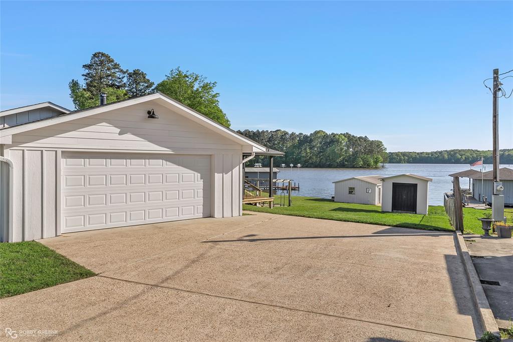 1615 Airport Loop Homer, LA 71040 - Photo 31 of 35 a house with trees in the background