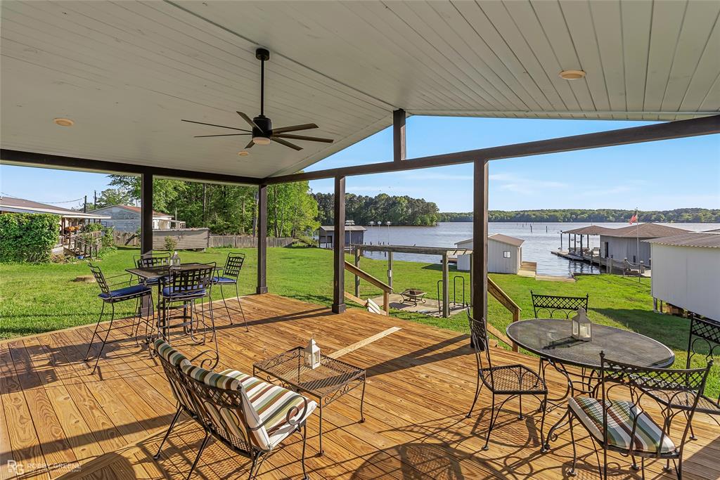 1615 Airport Loop Homer, LA 71040 - Photo 4 of 35 a view of a patio with a table chairs and a backyard