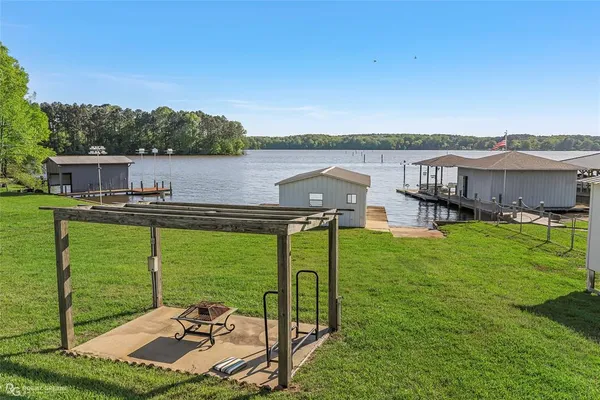 a view of a lake with a garden and houses