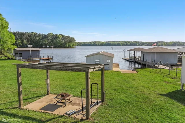 a view of a lake with a garden and houses