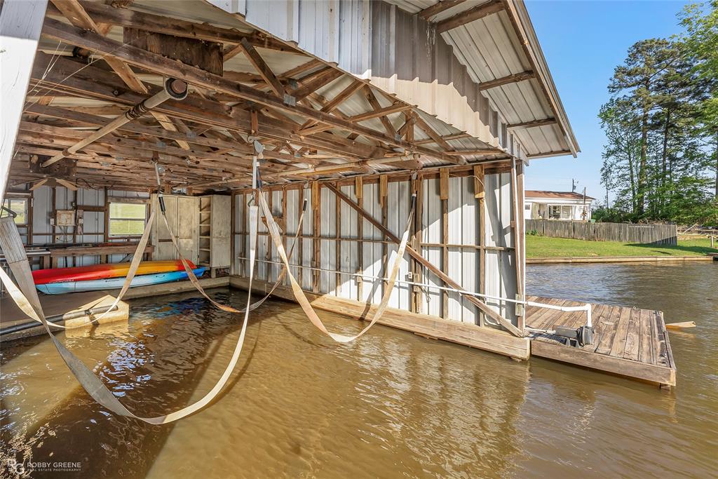 1615 Airport Loop Homer, LA 71040 - Photo 8 of 35 a view of a swimming pool with a patio and a yard