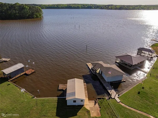 an aerial view of house with yard
