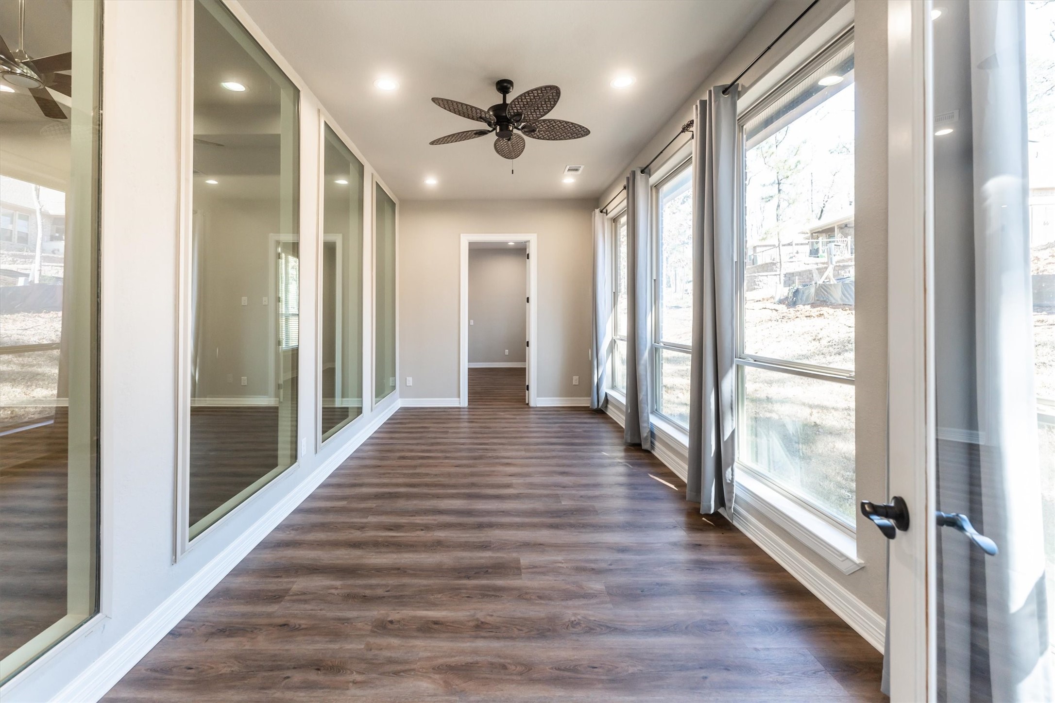 2172 Greentree Drive Huntsville, TX 77340 - Photo 25 of 45 Sun-drenched sunroom with oversized windows, flowing effortlessly between the primary bedroom and family room.