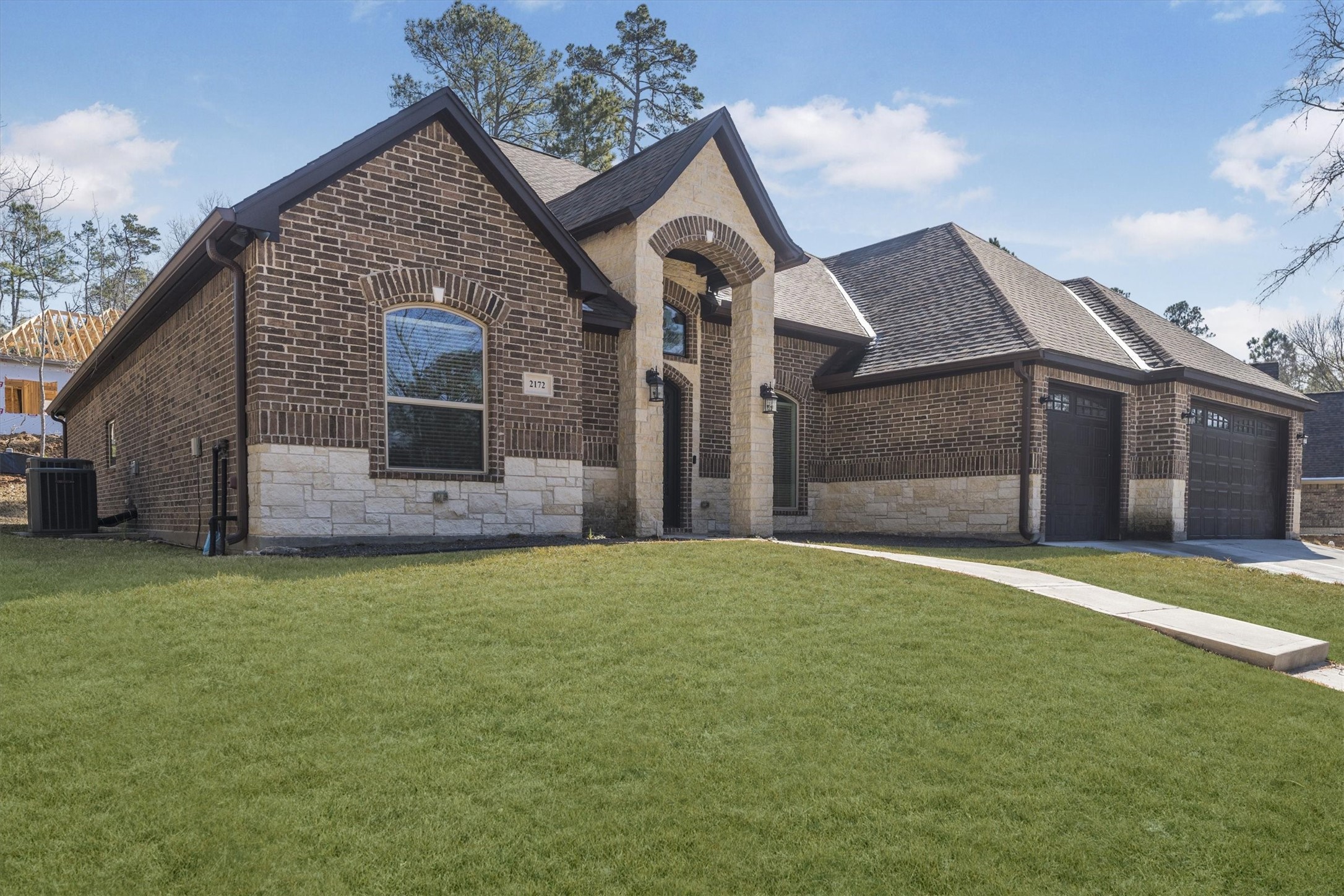 2172 Greentree Drive Huntsville, TX 77340 - Photo 3 of 45 Welcoming pathway that draws you naturally toward the home’s entrance.