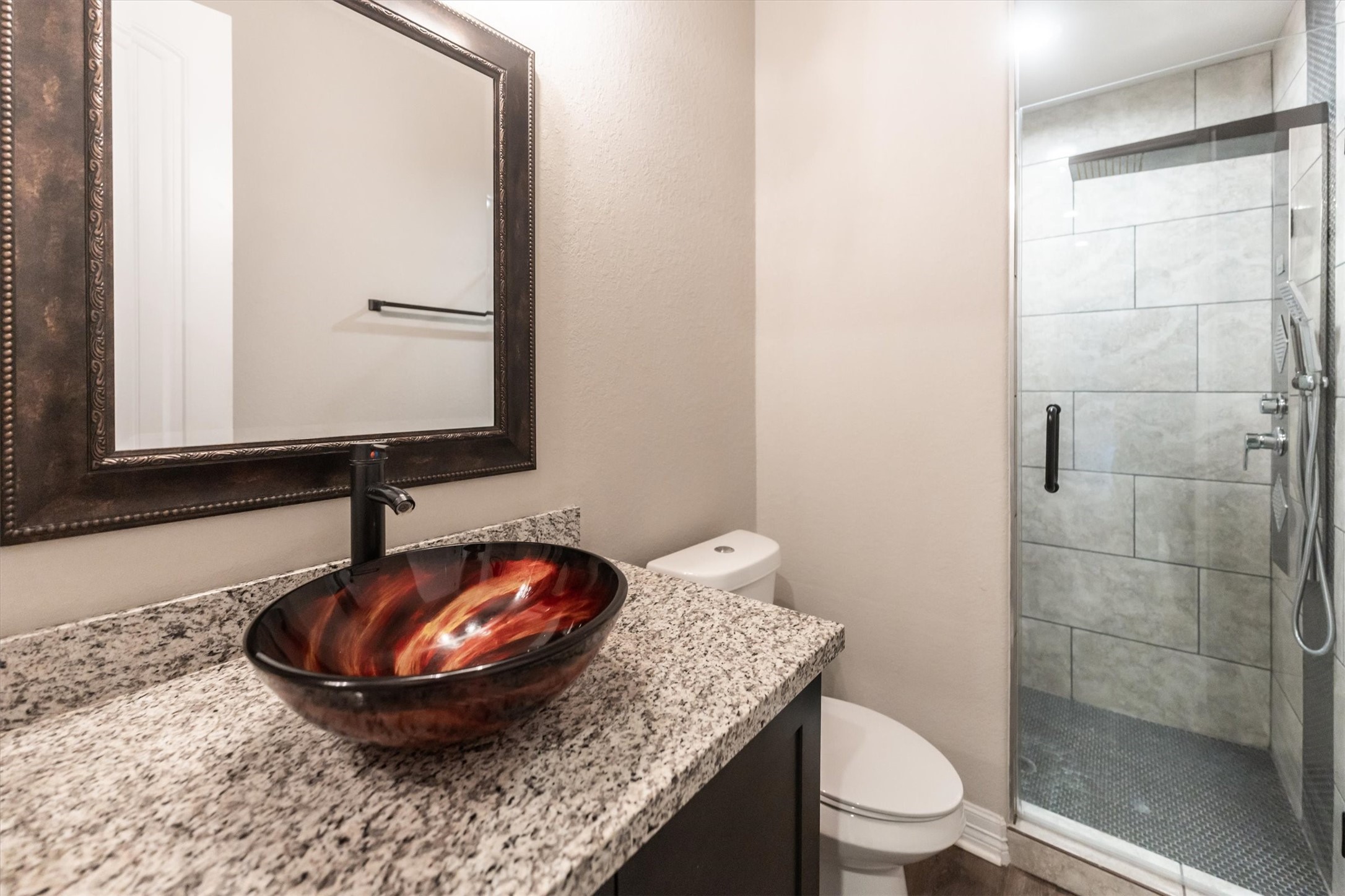 2172 Greentree Drive Huntsville, TX 77340 - Photo 36 of 45 Modern second bathroom featuring a sleek walk-in shower.