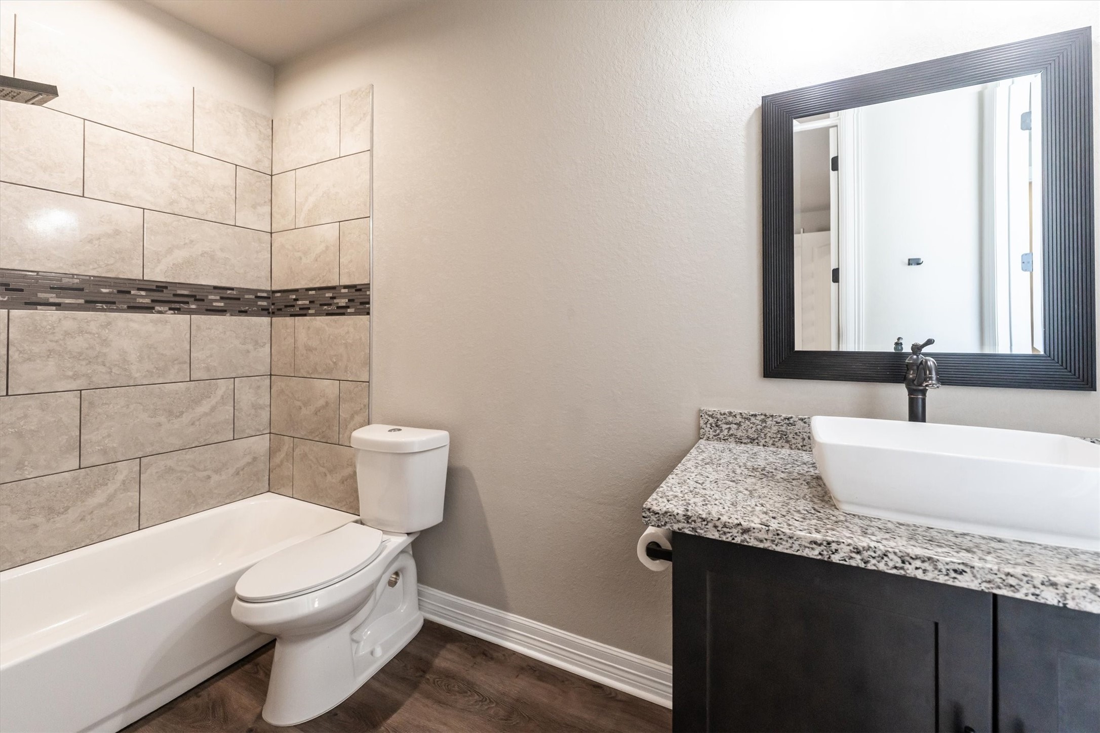 2172 Greentree Drive Huntsville, TX 77340 - Photo 40 of 45 Shared bathroom featuring a large oversized sink and shower-tub combo.