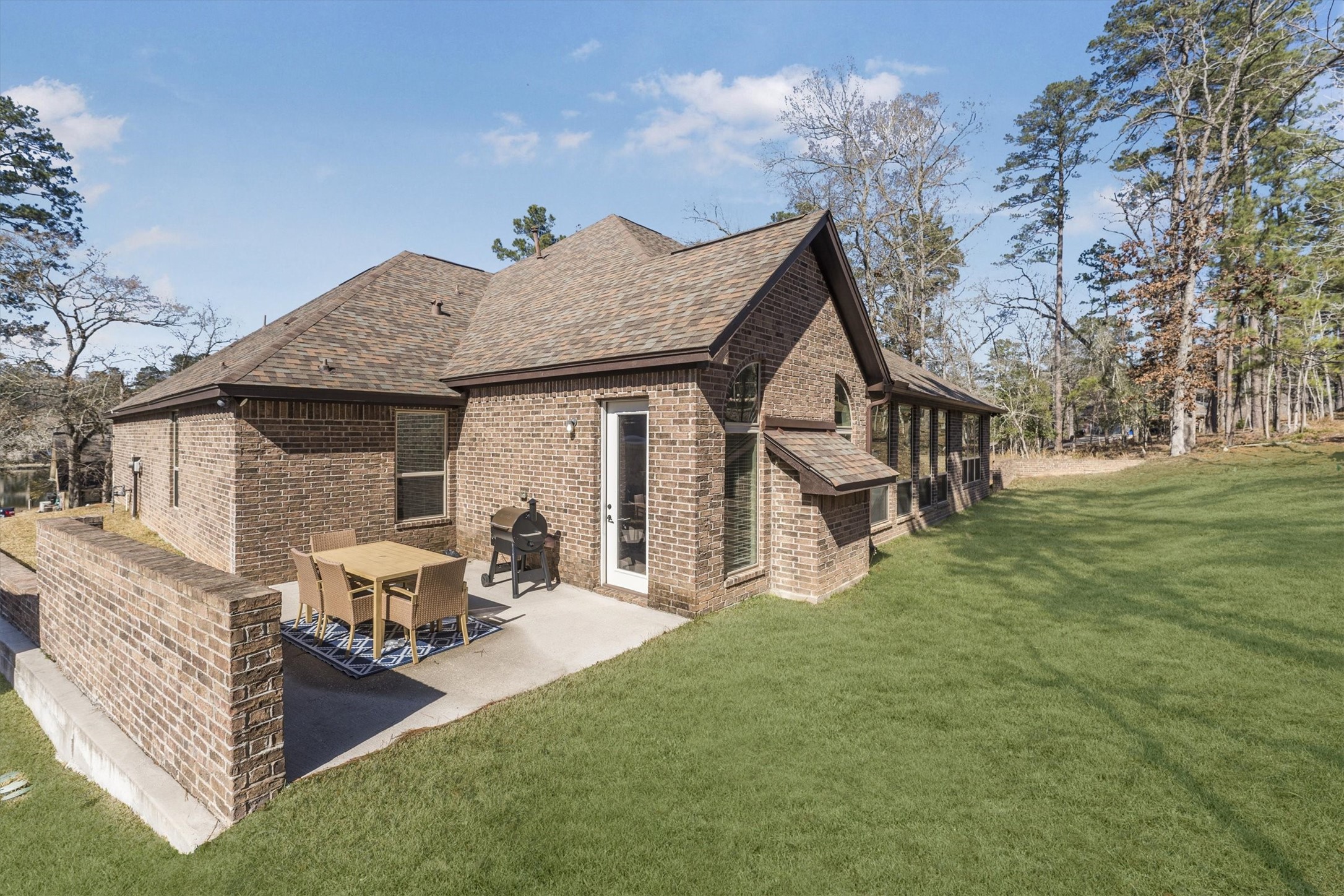 2172 Greentree Drive Huntsville, TX 77340 - Photo 43 of 45 Uncovered exterior porch, perfect for relaxing or entertaining outdoors.