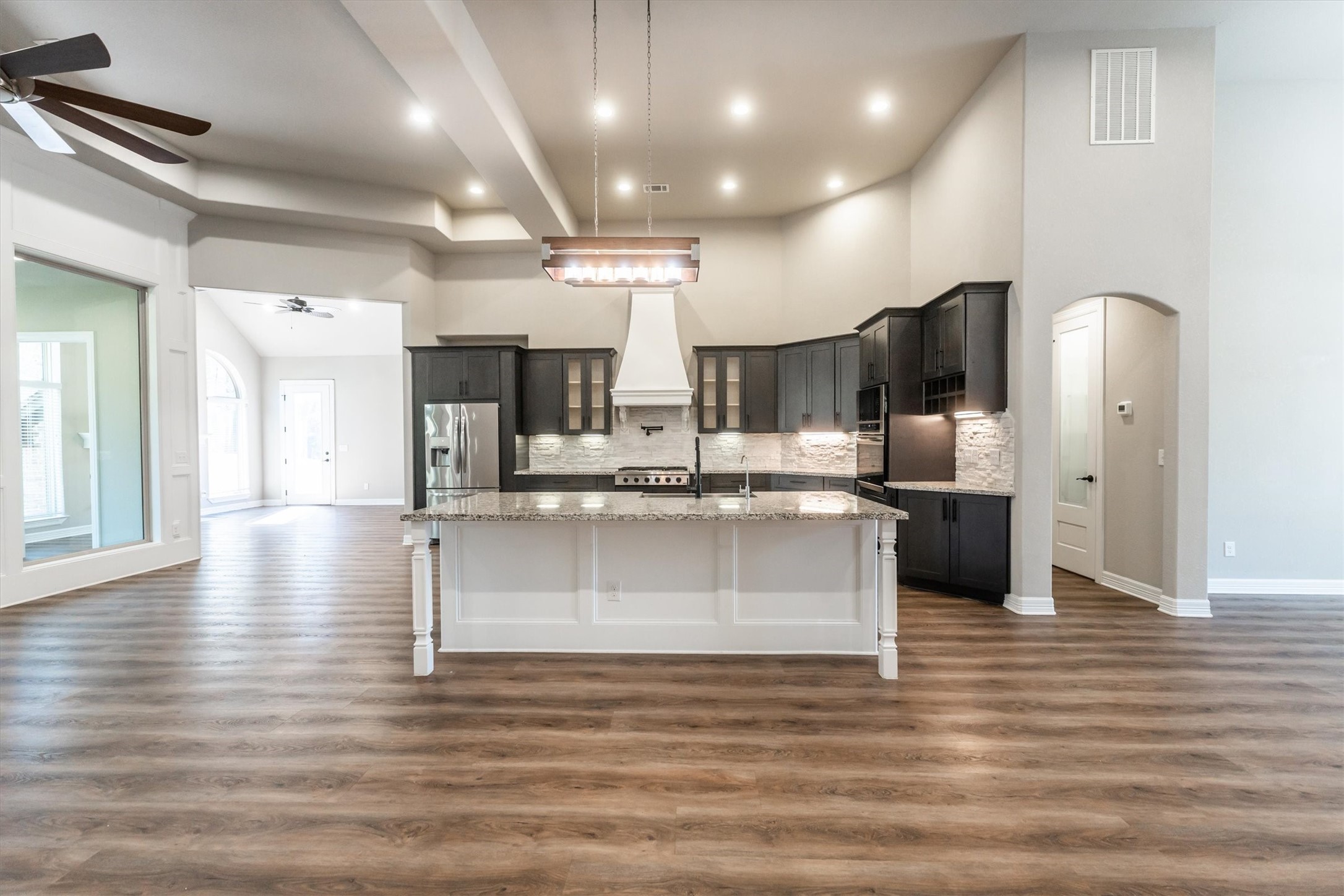 2172 Greentree Drive Huntsville, TX 77340 - Photo 10 of 45 Elegant entry flowing into a bright, open kitchen and dining area.