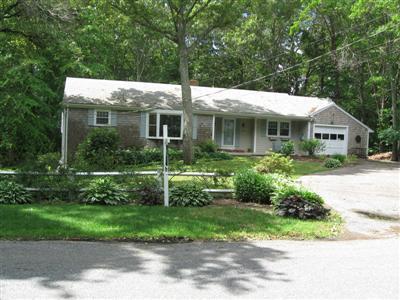 249 Holly Point Road Centerville, MA 02632 - Photo 1 of 20 a front view of house with a garden