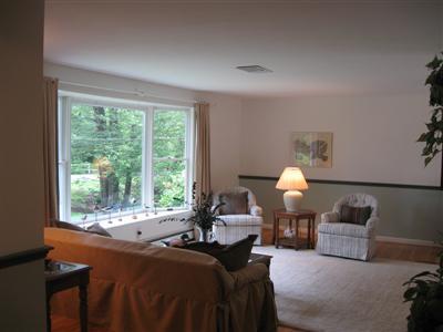 249 Holly Point Road Centerville, MA 02632 - Photo 11 of 20 a living room with furniture and a large window