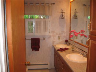 249 Holly Point Road Centerville, MA 02632 - Photo 16 of 20 a bathroom with a sink and a mirror