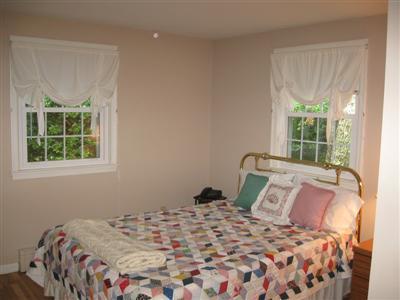 249 Holly Point Road Centerville, MA 02632 - Photo 18 of 20 a bedroom with a bed and a window