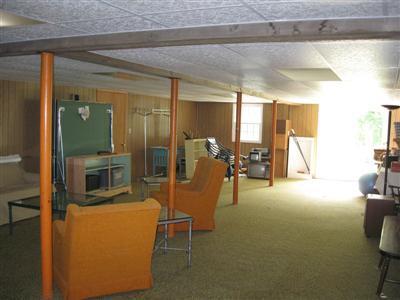 249 Holly Point Road Centerville, MA 02632 - Photo 20 of 20 a view of a livingroom with furniture and a flat screen tv