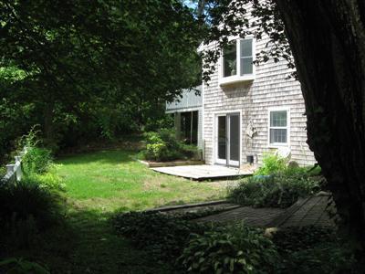 249 Holly Point Road Centerville, MA 02632 - Photo 5 of 20 a front view of a house with yard and green space