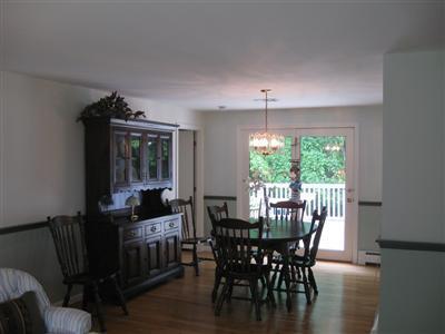 249 Holly Point Road Centerville, MA 02632 - Photo 7 of 20 a view of a dining room with furniture window and outside view