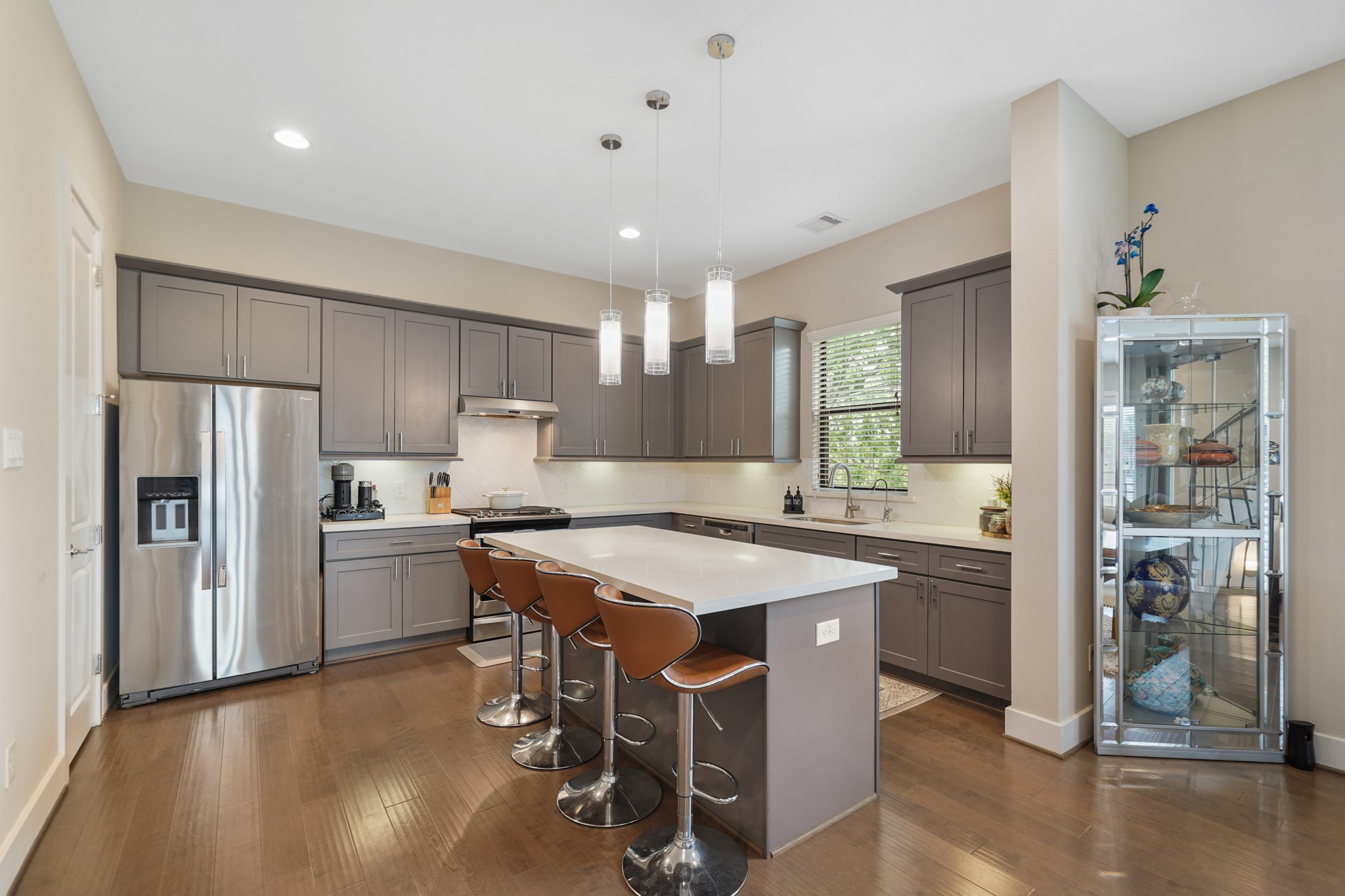 1824 Bonner Street Houston, TX 77007 - Photo 14 of 39 a kitchen that has a lot of cabinets a sink and appliances in it