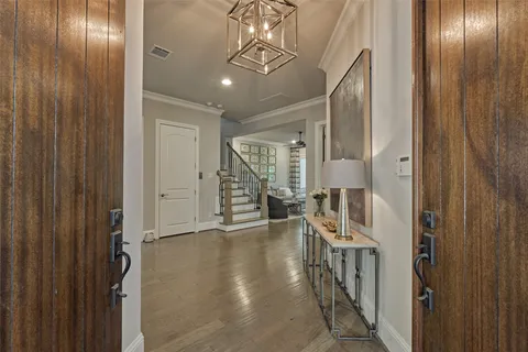a view of an entryway with wooden floor