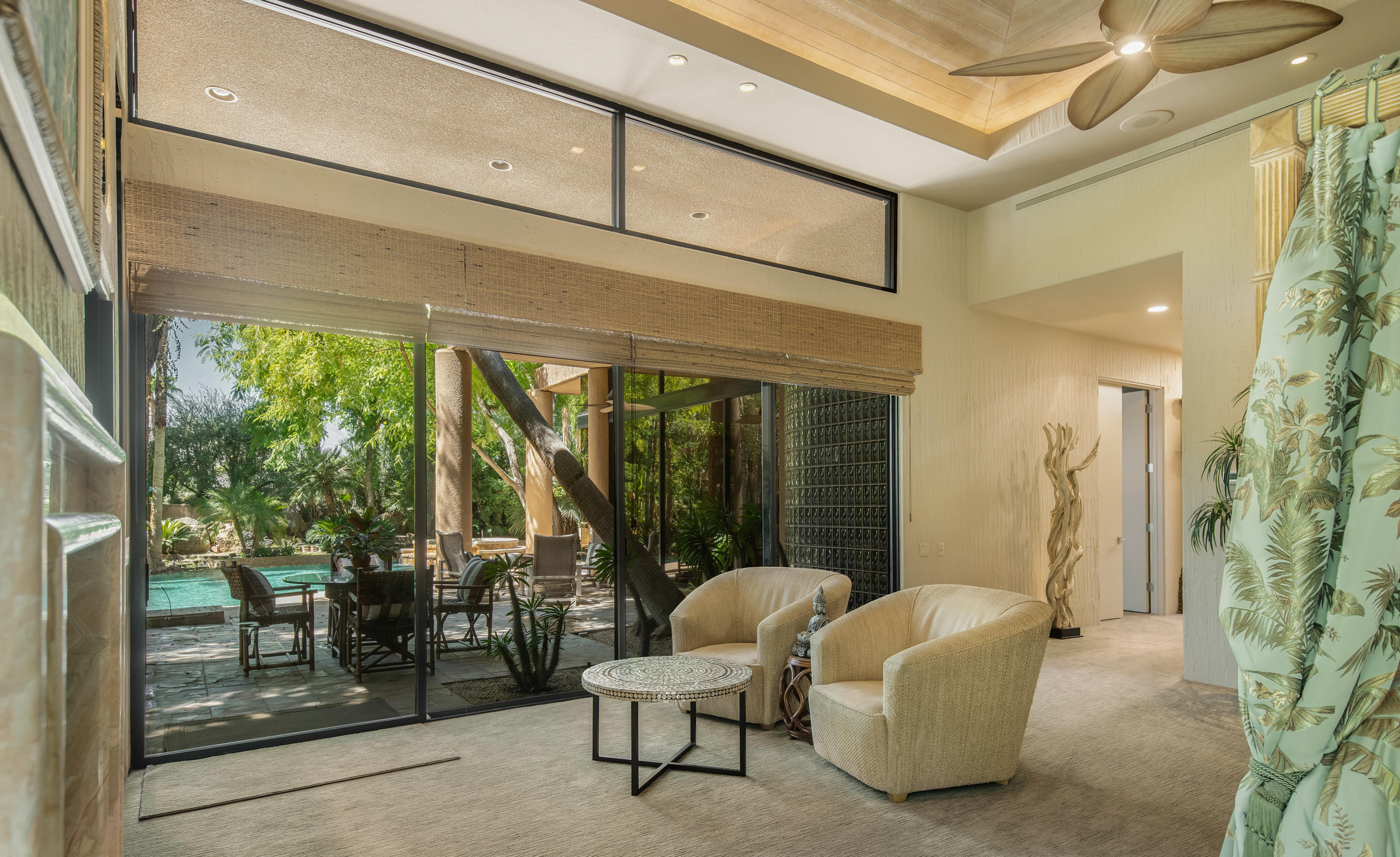 3 Mozart Lane Rancho Mirage, CA 92270 - Photo 18 of 41 a living room with furniture and a floor to ceiling window
