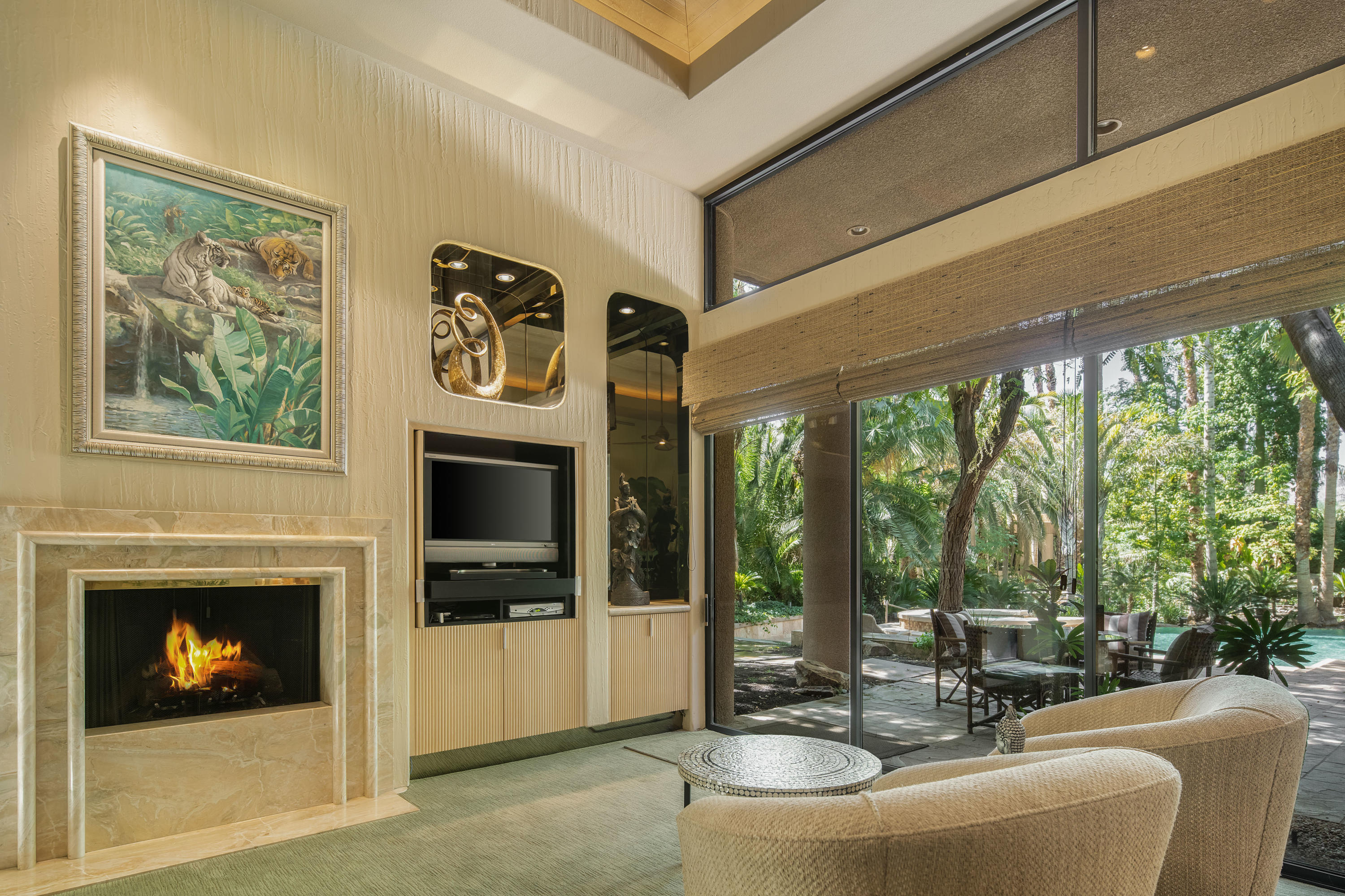 3 Mozart Lane Rancho Mirage, CA 92270 - Photo 19 of 41 a living room with furniture and a fireplace