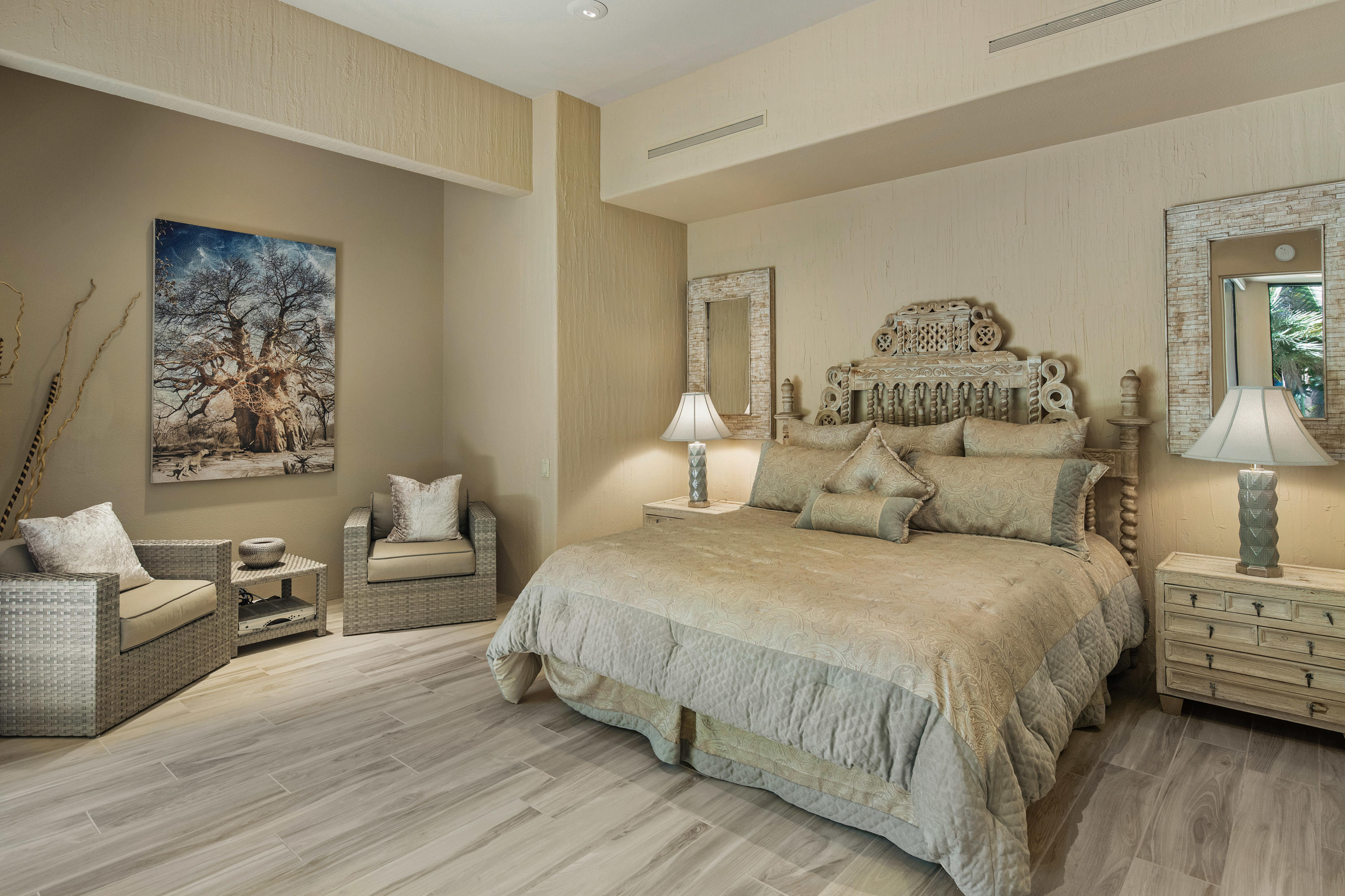 3 Mozart Lane Rancho Mirage, CA 92270 - Photo 22 of 41 a bedroom with a bed and a couch