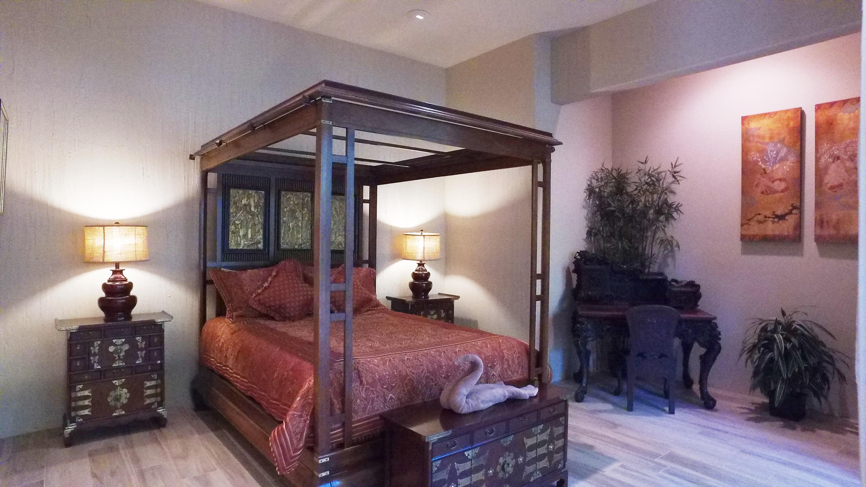 3 Mozart Lane Rancho Mirage, CA 92270 - Photo 29 of 41 a bedroom with a bed and wooden floor