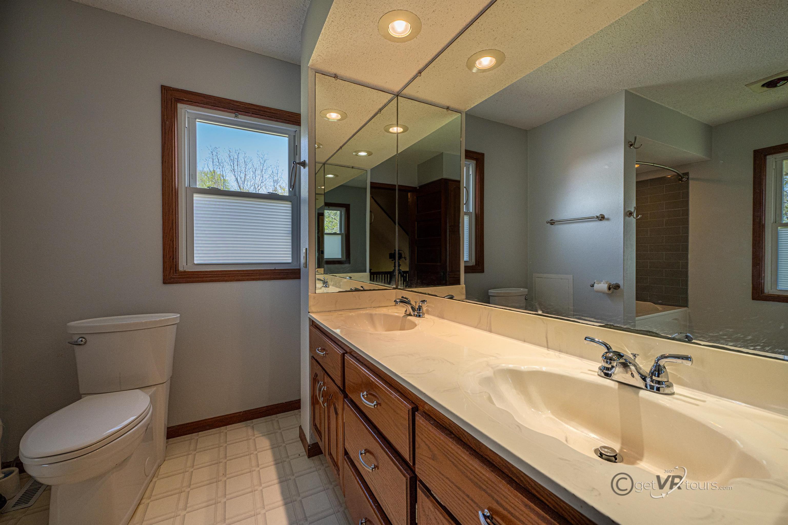 6844 Highway 20 Freeport, IL 61032 - Photo 14 of 31 a bathroom with a sink double vanity granite and a toilet