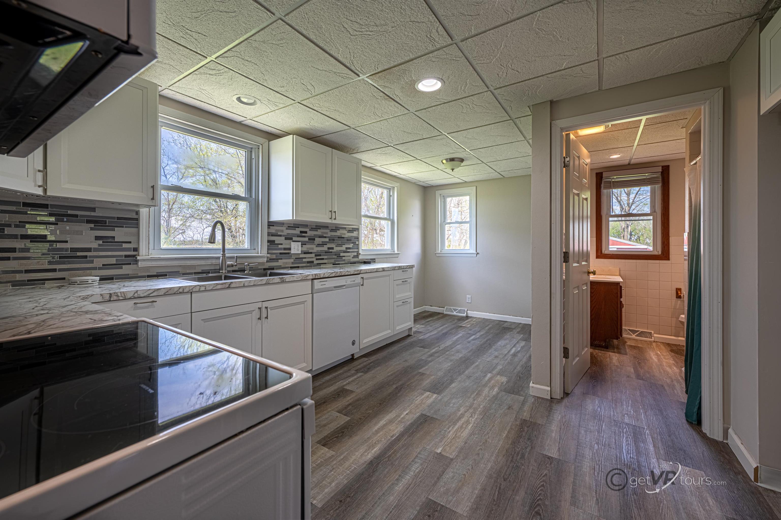 6844 Highway 20 Freeport, IL 61032 - Photo 15 of 31 a kitchen with a sink stove and cabinets