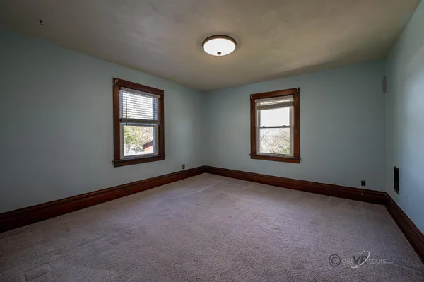 an empty room with windows