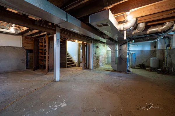 a view of an empty room with wooden walls