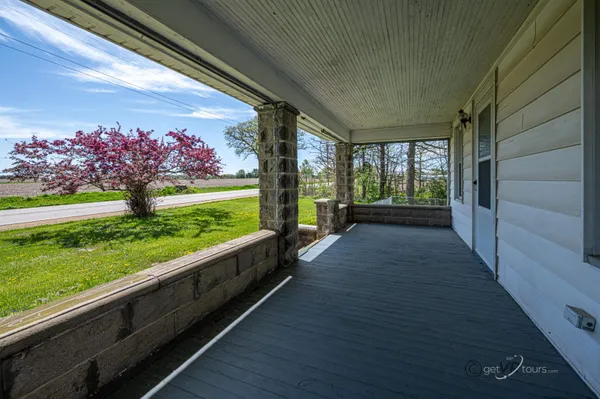 a view of a porch and garden